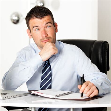 Premium Photo Pensive Businessman Looking Up In Office With Pen