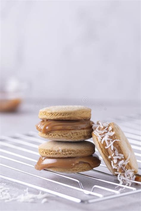 Vertical Shot Of Delicious Macarons Of Various Fillings Stacked On A