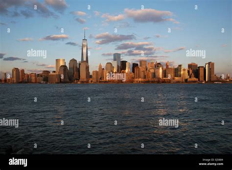 Panoramic view of New York City Skyline on water featuring One World ...