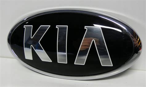 KIA SPORTAGE 3 EMBLEMAT ZNACZEK LOGO ATRAPA 12148557777 Oficjalne