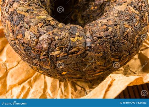 Chinese Pressed Pu Erh Tea On Wrapping Paper Close Up Macro Stock