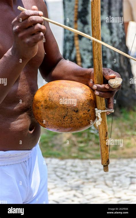 Musician Playing A Traditional Brazilian Percussion Instrument Called