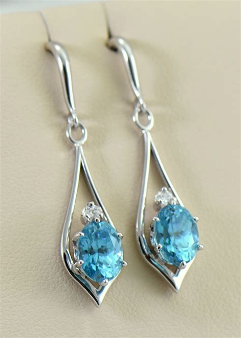 Natural Blue Zircon And Diamond Earrings In White Gold