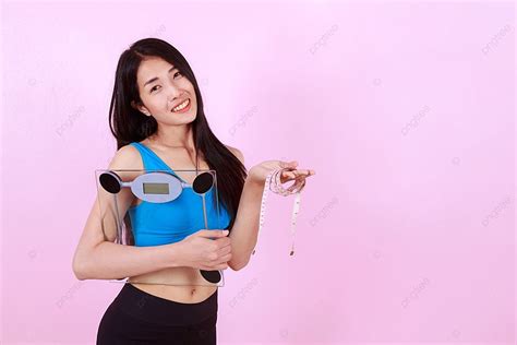 Happy Slim Woman Holding A Weight Scale Photo Background And Picture