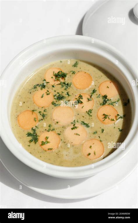 German Traditional KARTOFFELSUPPE Potato And Sausage Soup On White