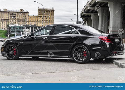 Black Mercedes Amg S63 Parked Along The Street Rear Side View Of