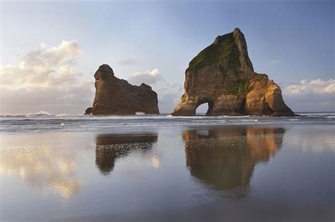 Print Of Archway Islands Reflected In Wet Sands Of Wharariki Beach