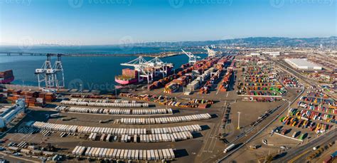 The Oakland Outer Harbor Aerial View Loaded Trucks Moving By Container