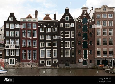 Traditional canal side houses Amsterdam Holland Netherlands Europe EU ...