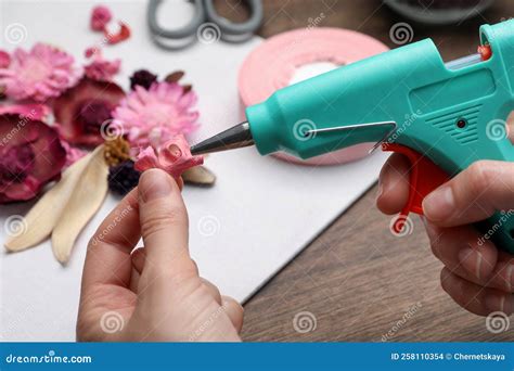 Woman Using Hot Glue Gun To Make Craft At Wooden Table Closeup Stock Photo Image Of Greeting