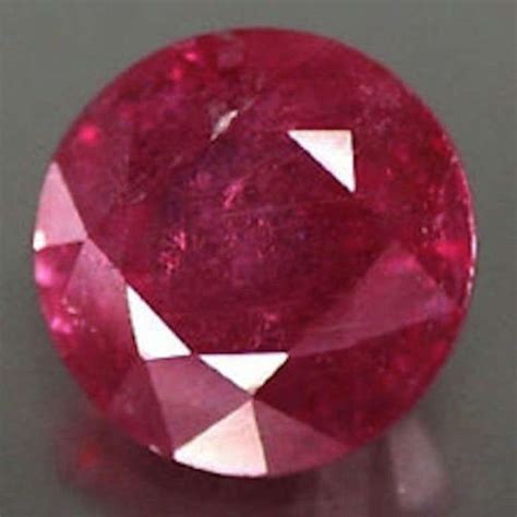 Loose Round Faceted Ruby With Visible Inclusions Lab Created Ruby