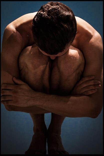 Premium Photo Close Up Of Naked Man Hugging Knees