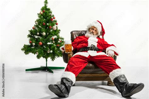 Santa Claus Drinking Beer Near The Christmas Tree Congratulating