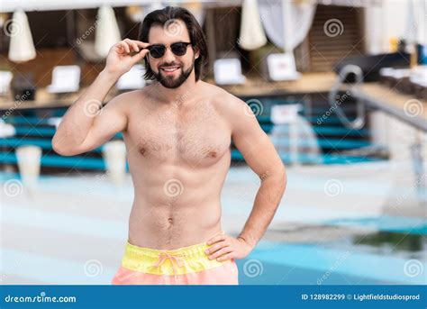 Handsome Bearded Man In Sunglasses Posing At Swimming Stock Image