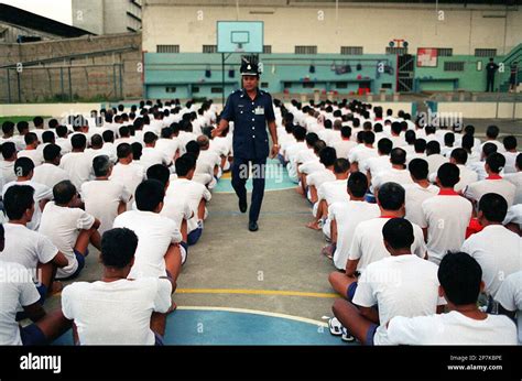 Prison officer and prisoners at Changi Prison.(Singapore Press via AP Images Stock Photo - Alamy