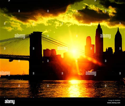 sunset Brooklyn Bridge and New York skyline Stock Photo - Alamy