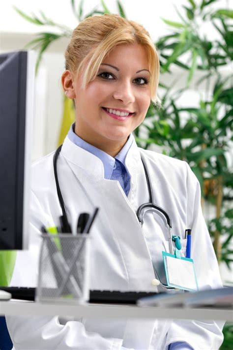 Portrait Of A Friendly Smiling Female Doctor Stock Photo Image Of