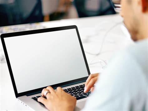 Man Working On Macbook Mockup The Mockup Club