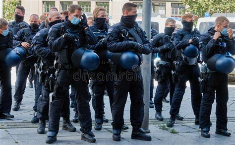 German Police Officers in Combat Uniforms and with Helmets in Hand ...