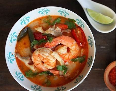 Tom yum ตมยำ hot and sour soup a national dish for Thailand Every Thai family cooks it