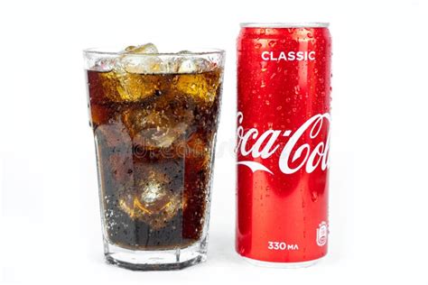 Glass Of Cold Refreshing Coca Cola Soda With Ice Metal Can Of Coca