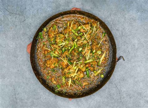 Indian Pakistani Food Chicken Karahi Garnished With Ginger And Green