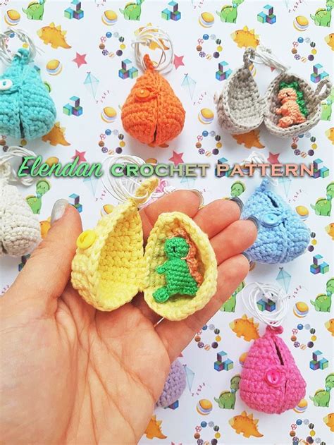 Crochet Baby Booties Are Being Held In Front Of A Card With The Words