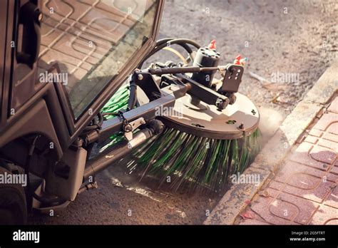 Street cleaning machine with truck brushes. Close up shot Stock Photo ...