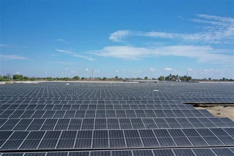 Aerial View Of A Large Scale Solar Farm With An Array Of Black Solar