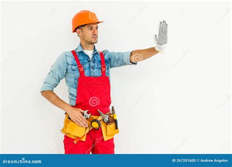 Shows Stop Sign by Hand. Construction Worker in Uniform and Safety ...