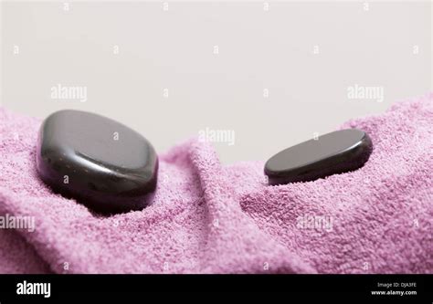 Spa Relax Body Care Concept Zen Hot Massage Stone Pebbles On Pink Towel Healthy Lifestyle