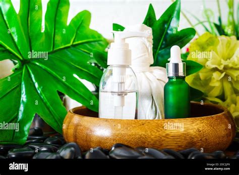 Thai Spa Massage Setting With Serum Oil Bottle Dropper Mock Up Or Essential Oil And Thai Herbal