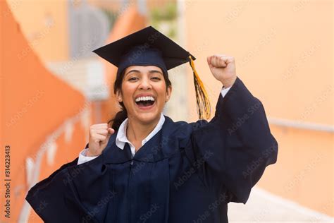 Young hispanic female graduate at her graduation Stock Photo | Adobe Stock