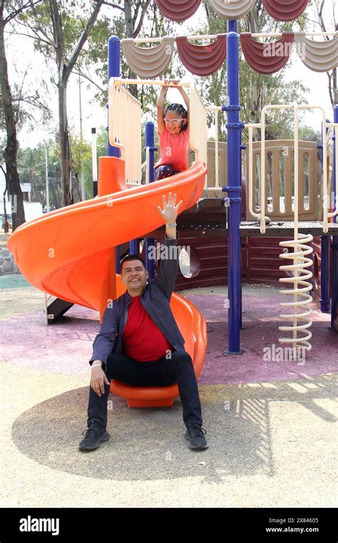 Divorced Single Dad Plays With His Brunette Latina Daughter On The Park Slide Enjoying Quality