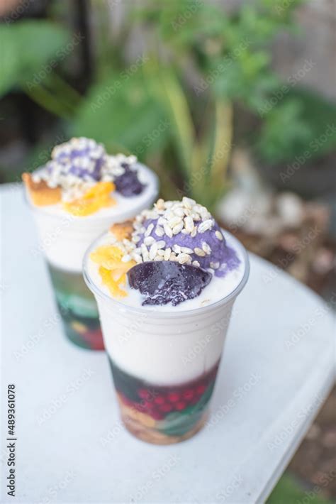 Two Plastic Cups Of Halo Halo A Popular Cold Dessert In The