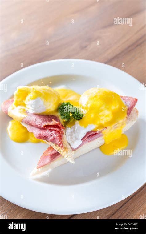 Eggs Benedict Breakfast Toasted English Muffins Ham Poached Eggs With Buttery Hollandaise