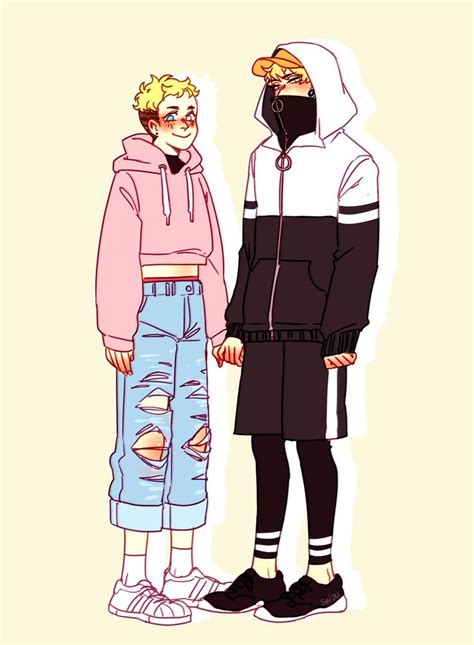 Two People Standing Next To Each Other Wearing Hoodies