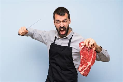 Premium Photo Chef Holding A Raw Meat