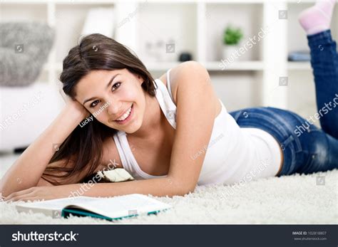 Teenage Girl Lying On Floor Reading Stock Photo 102818807 | Shutterstock