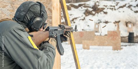 Special forces soldier in action, shooting from rifle machine gun Stock ...