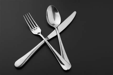 Premium Photo Fork Knife And Spoon On Black Background