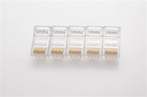 Premium Photo | Several rg 45 connectors for internet cables lie on a ...