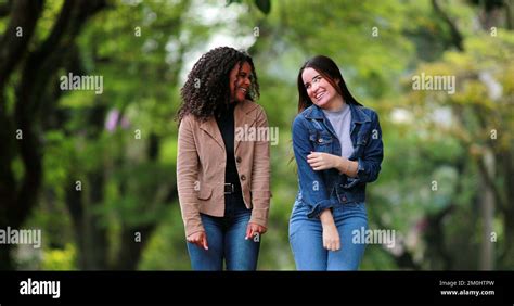 Fun Happy Two Diverse Girlfriends Jumping And Dancing In Joy People