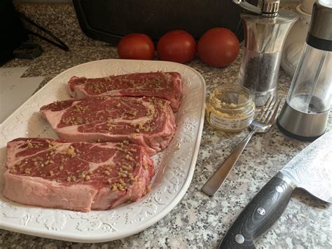 [homemade] Boneless Ribeye Steaks With Salt Pepper And Roasted Garlic Ready For Searing R Food