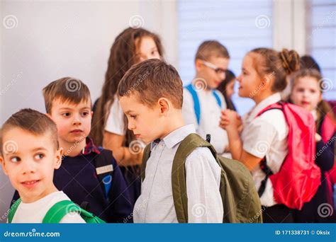 School Children In Uniform With Backpacks Going To Class Stock Image