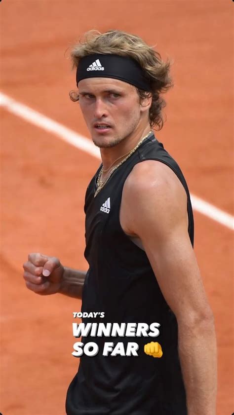 a male tennis player in a black shirt and headband