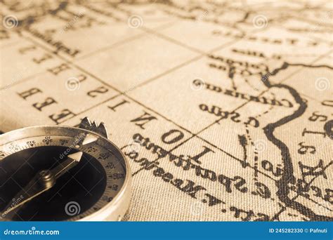 Magnetic Old Compass On World Vintage Map Travel Geography Navigation Tourism And Exploration