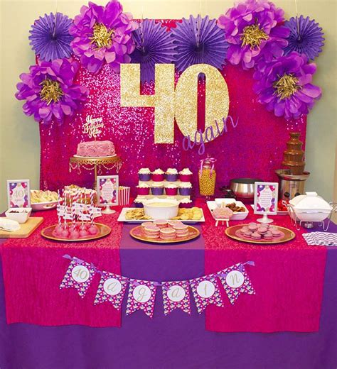 A Table Topped With Lots Of Food And Desserts Next To A Sign That Says 40