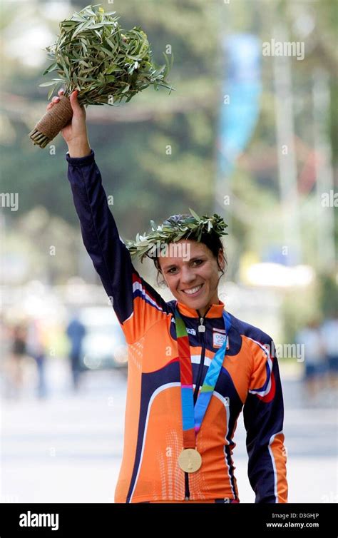 (dpa) - Dutch cyclist Leontien Zijlaard van Moorsel cheers with a bunch ...