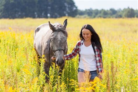 Premium Photo | Young woman with a horse